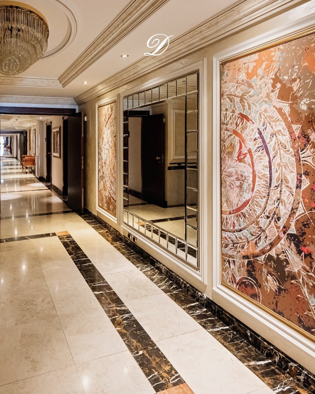 A corridor where art, light, and luxury meet inviting you to slow down and enjoy the moment